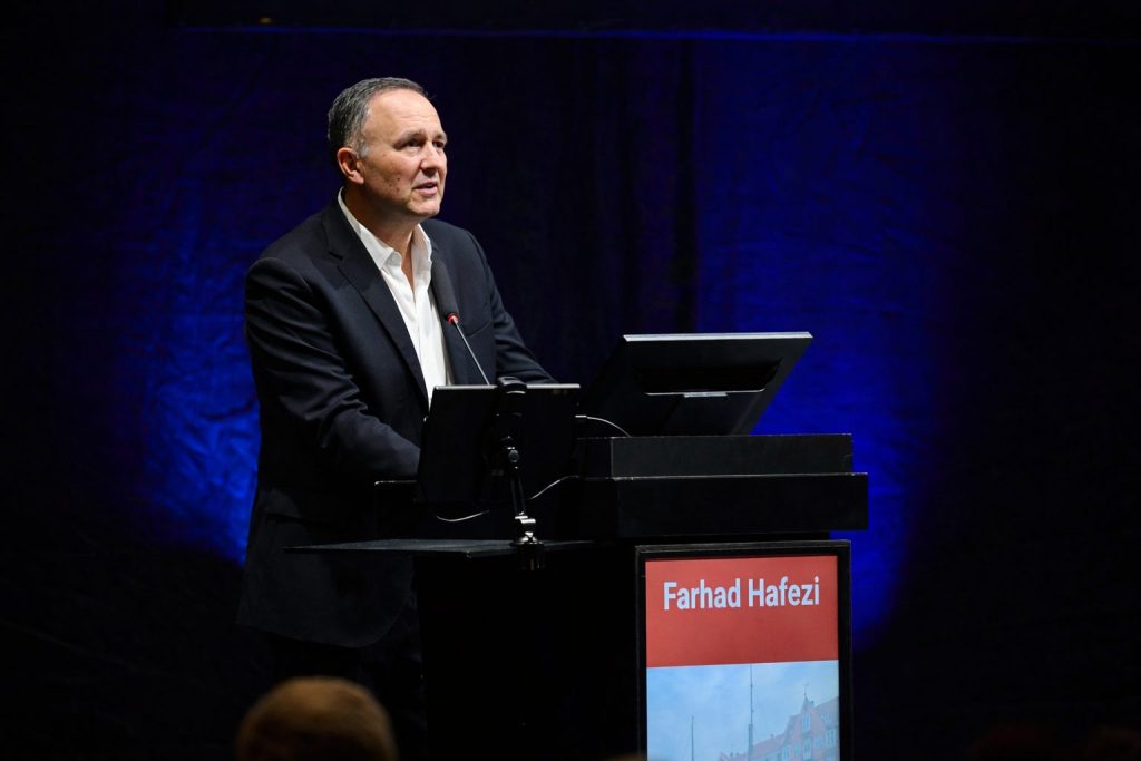 Farhad Hafezi, 2026 Power List honoree, on stage at a podium